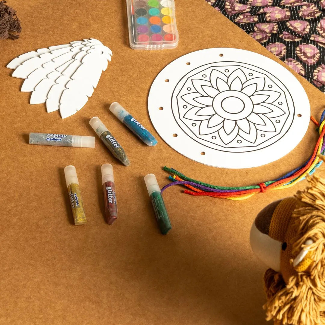 NESTA TOYS -DIY dream catcher kit components including threads, colors, and mandala cutouts