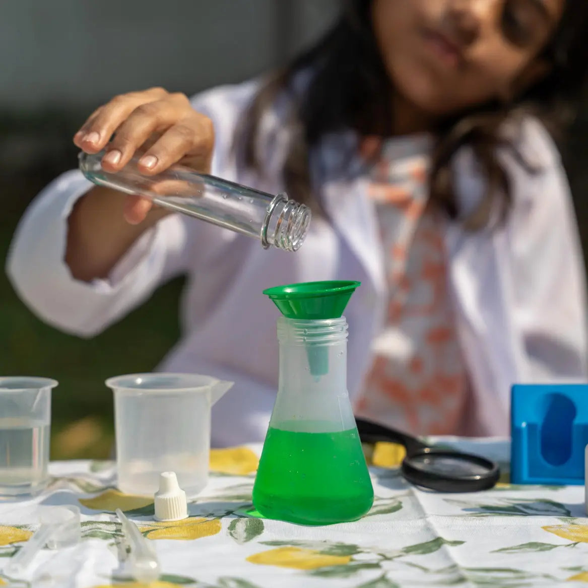 NESTA TOYS Child performing hands-on experiments with the Nesta Toys Junior Chemistry Lab Kit