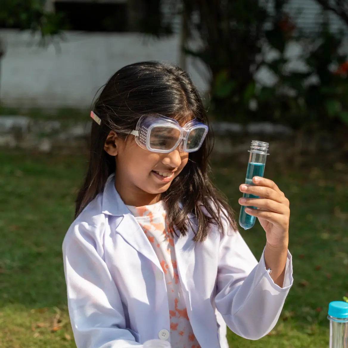 NESTA TOYS Child performing hands-on experiments with the Nesta Toys Junior Chemistry Lab Kit