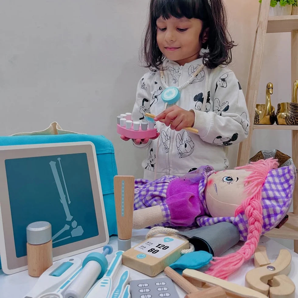 NESTA TOYS Kid playing with NESTA TOYS wooden doctor set, enjoying pretend medical role play and learning through imaginative play