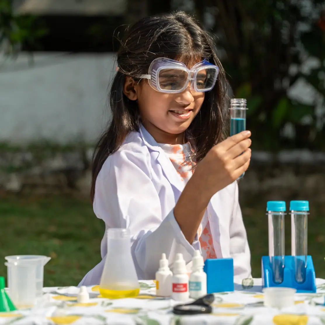 NESTA TOYS Child performing hands-on experiments with the Nesta Toys Junior Chemistry Lab Kit