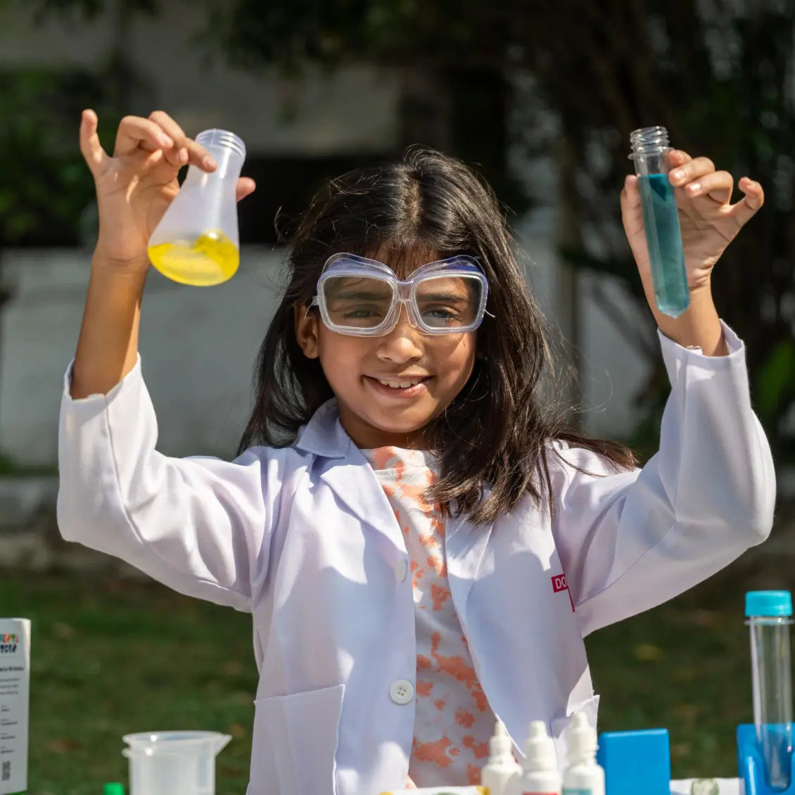 NESTA TOYS Child performing hands-on experiments with the Nesta Toys Junior Chemistry Lab Kit