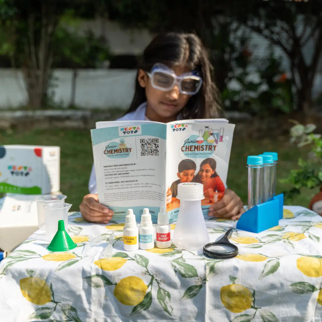 NESTA TOYS Child performing hands-on experiments with the Nesta Toys Junior Chemistry Lab Kit