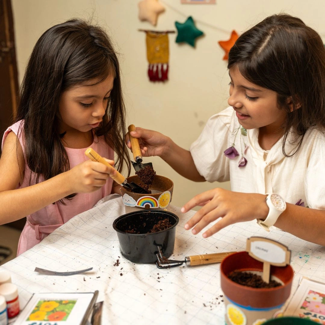 NESTA TOYS Child enjoying hands-on plant science activities with the Nesta Toys Gardening Kit