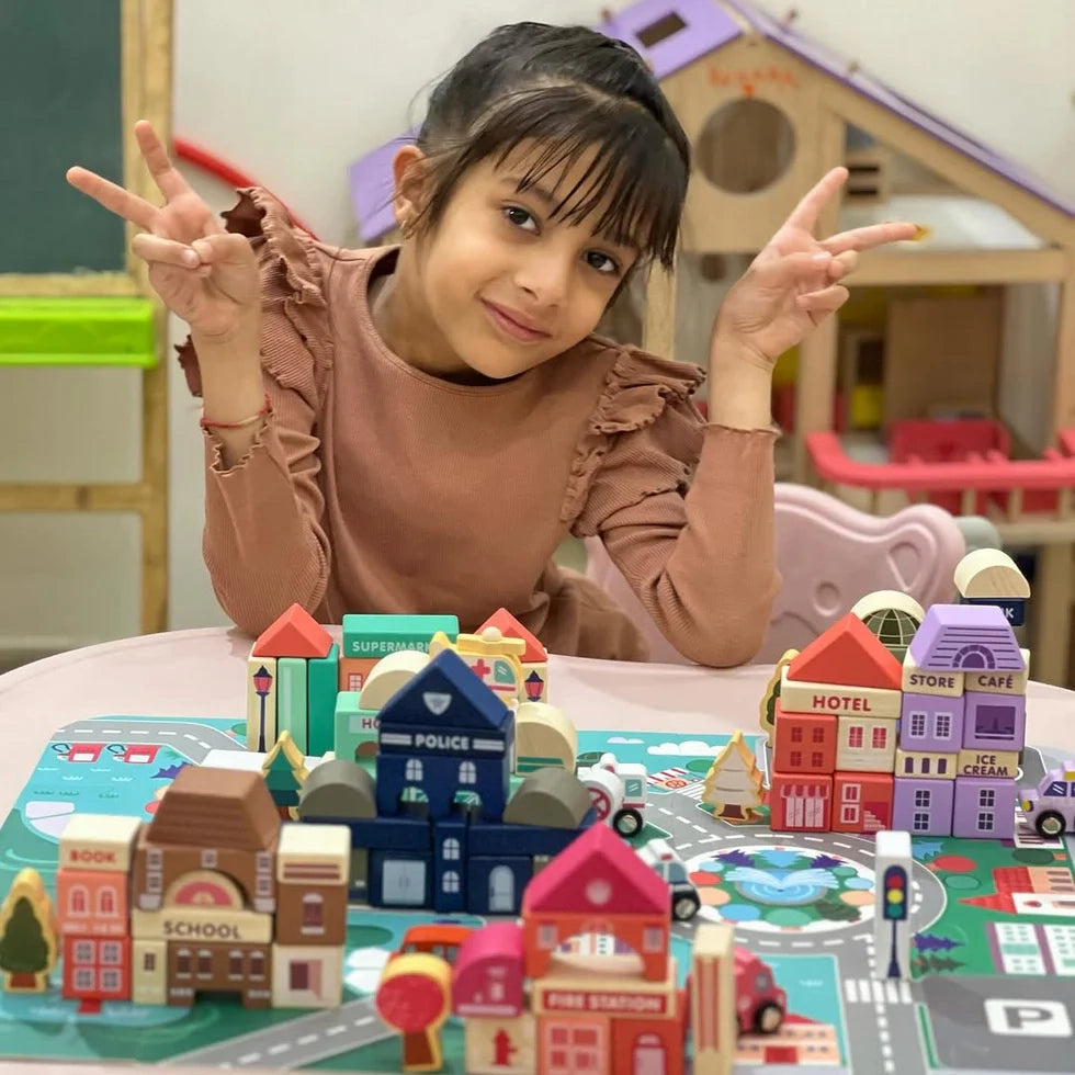 Child Playing with NESTA TOYS 115 Pieces Wooden City Building Blocks, Exploring Creativity and Building Skills