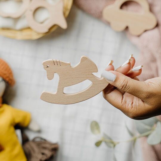 Wooden horse teether made from natural beech wood to soothe baby gums