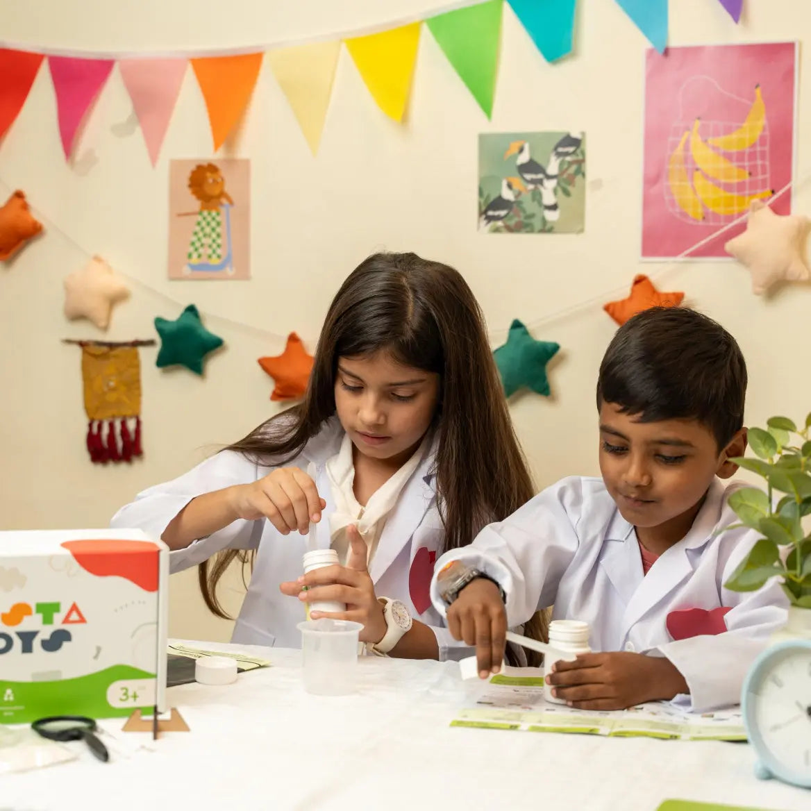 Kids exploring science and chemistry using the Glow in The Dark Lab Kit