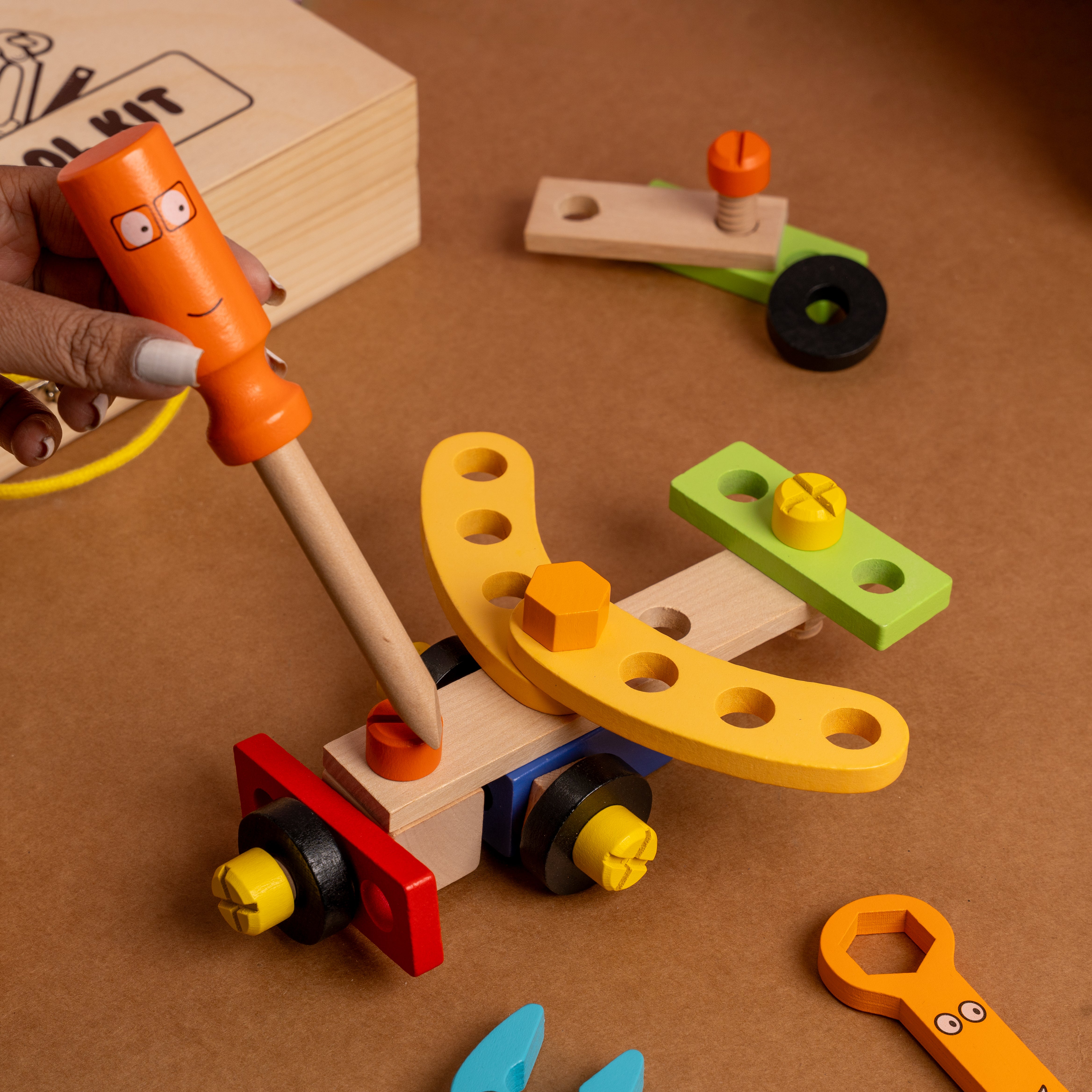 Montessori-inspired wooden tool kit with smooth edges and child-safe paints