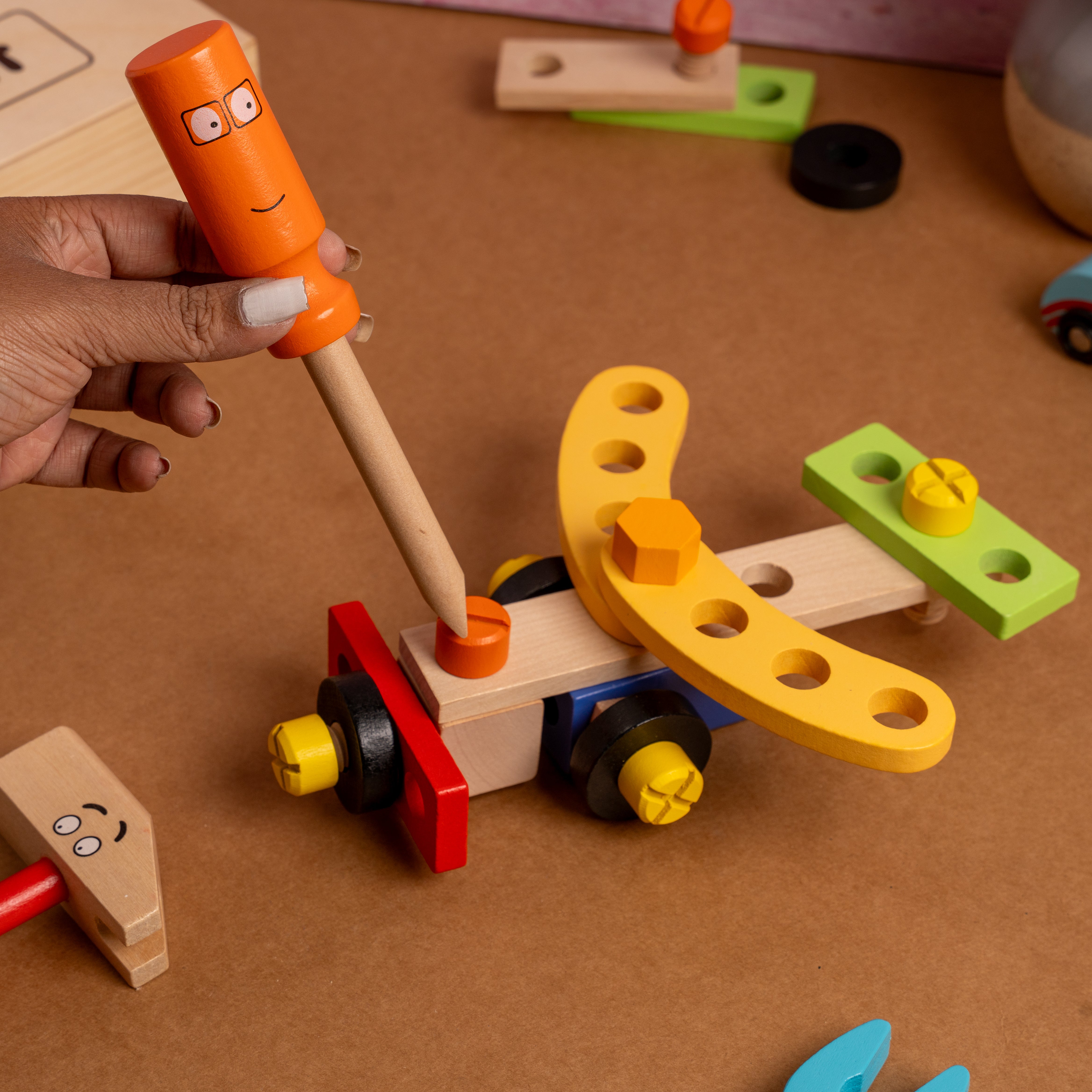 Montessori-inspired wooden tool kit with smooth edges and child-safe paints