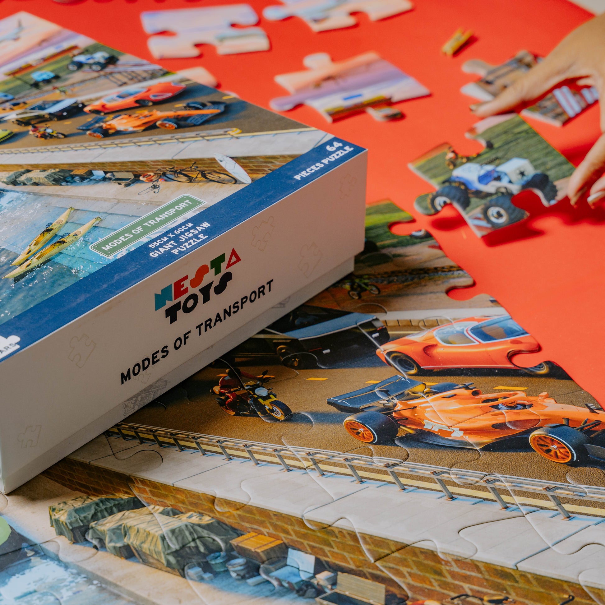 64-piece transport-themed jigsaw puzzle by NESTA TOYS for developing problem-solving and coordination skills.
