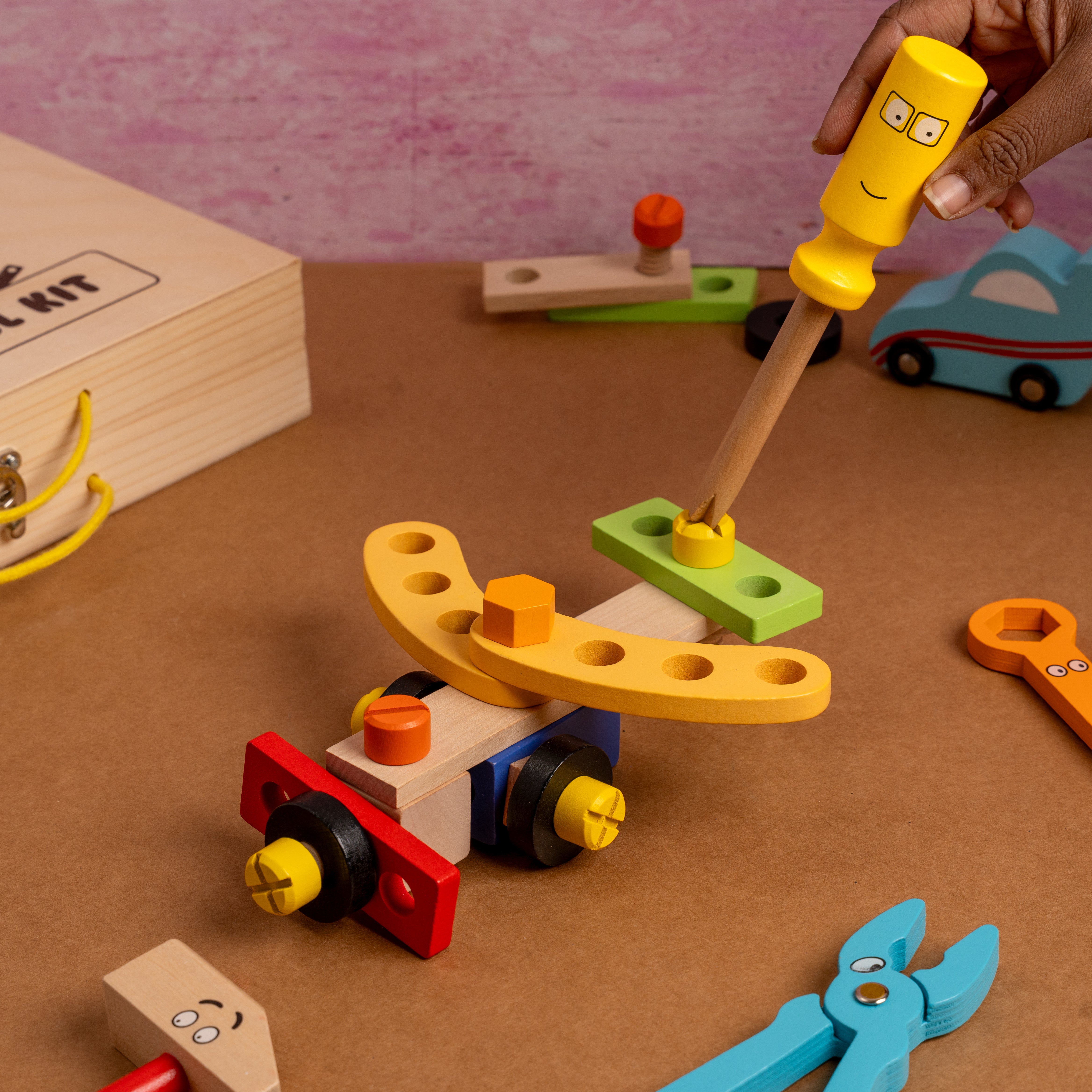 Montessori-inspired wooden tool kit with smooth edges and child-safe paints