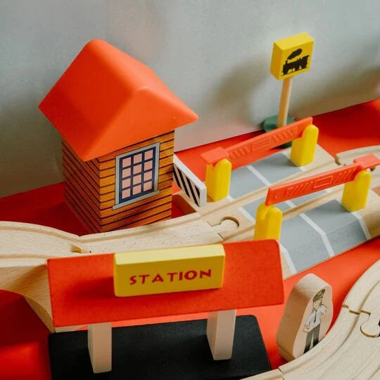 Wooden train track toy set with vehicles designed for creative and open-ended play